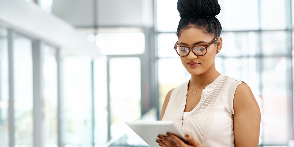 a black female student on an ipad