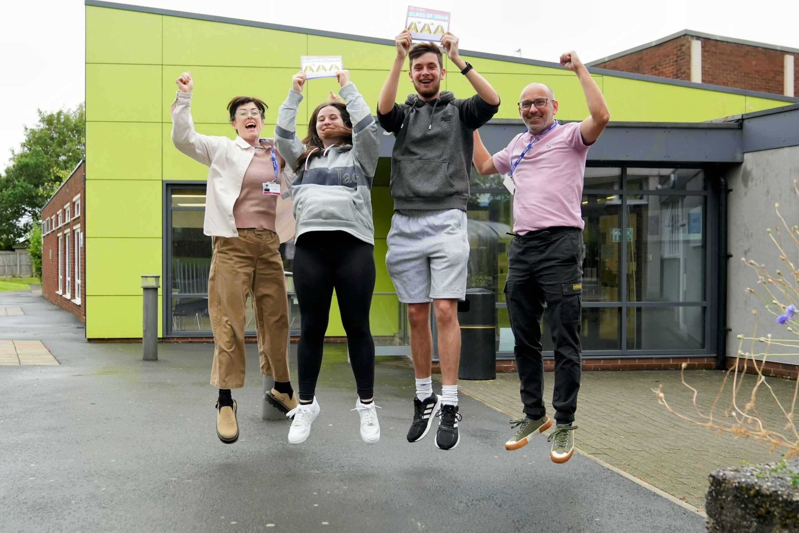 four students outside college celebrating their a level resuls