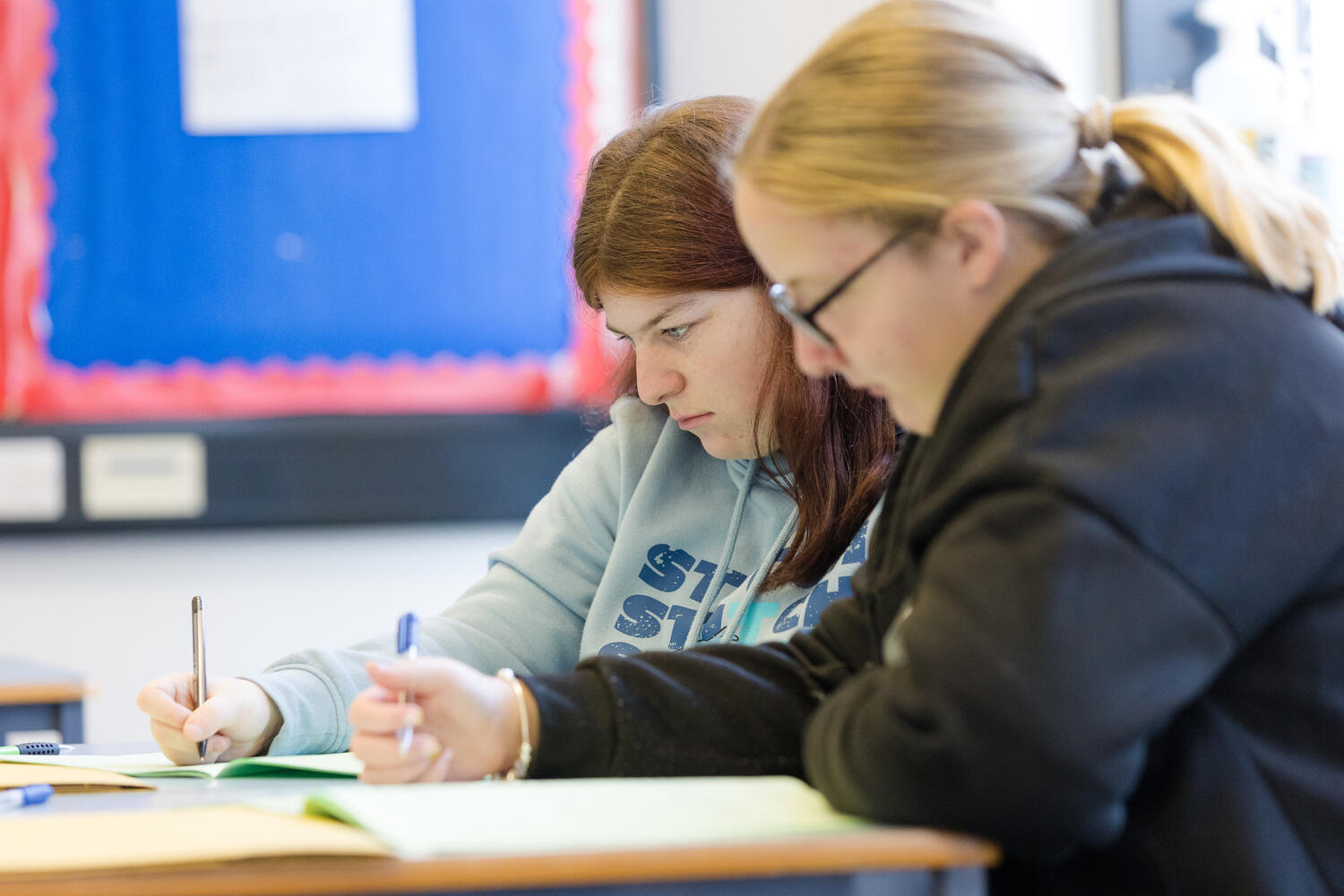 two students studying at a desk